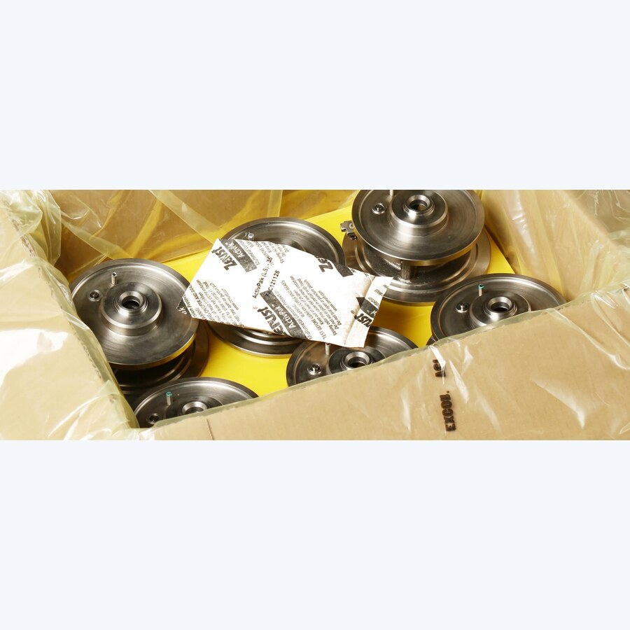 Zásobník Zerust ActivPak medzi kovovými dielmi